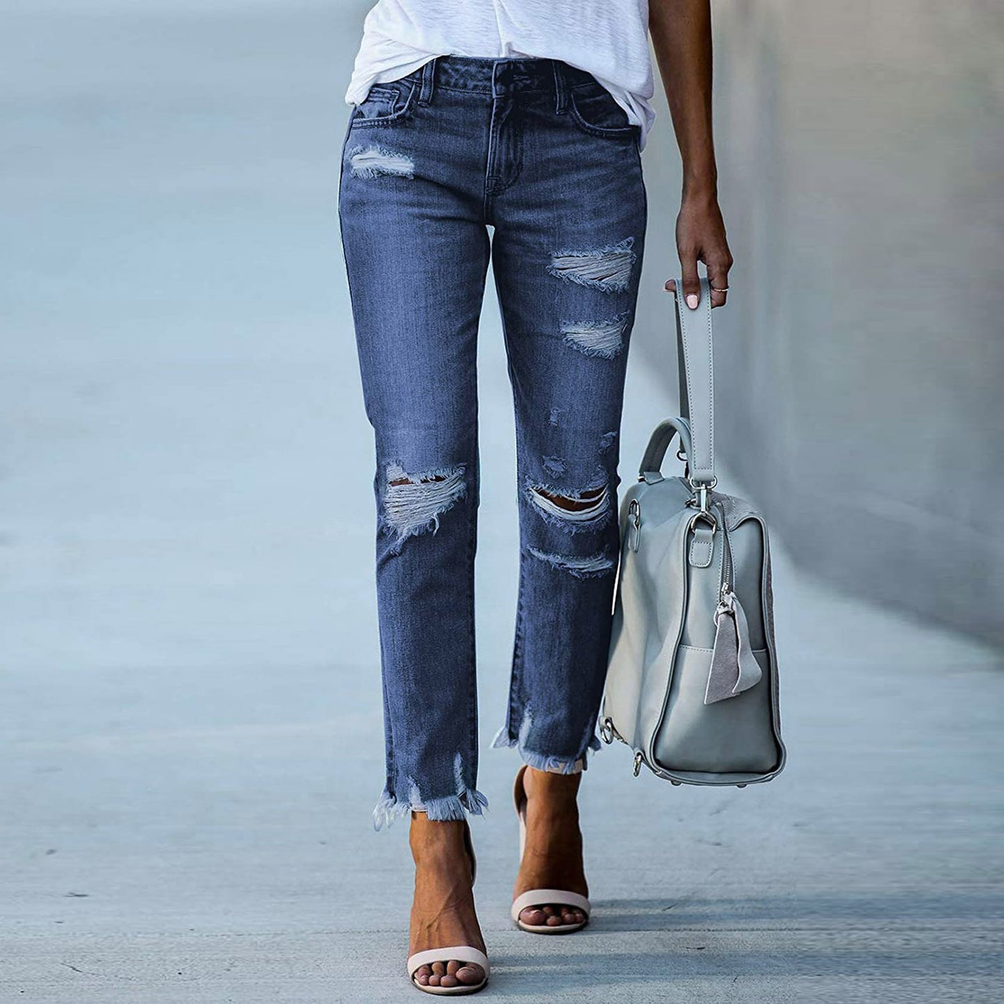 Young women's tight-fitting solid white jeans with ripped jeans