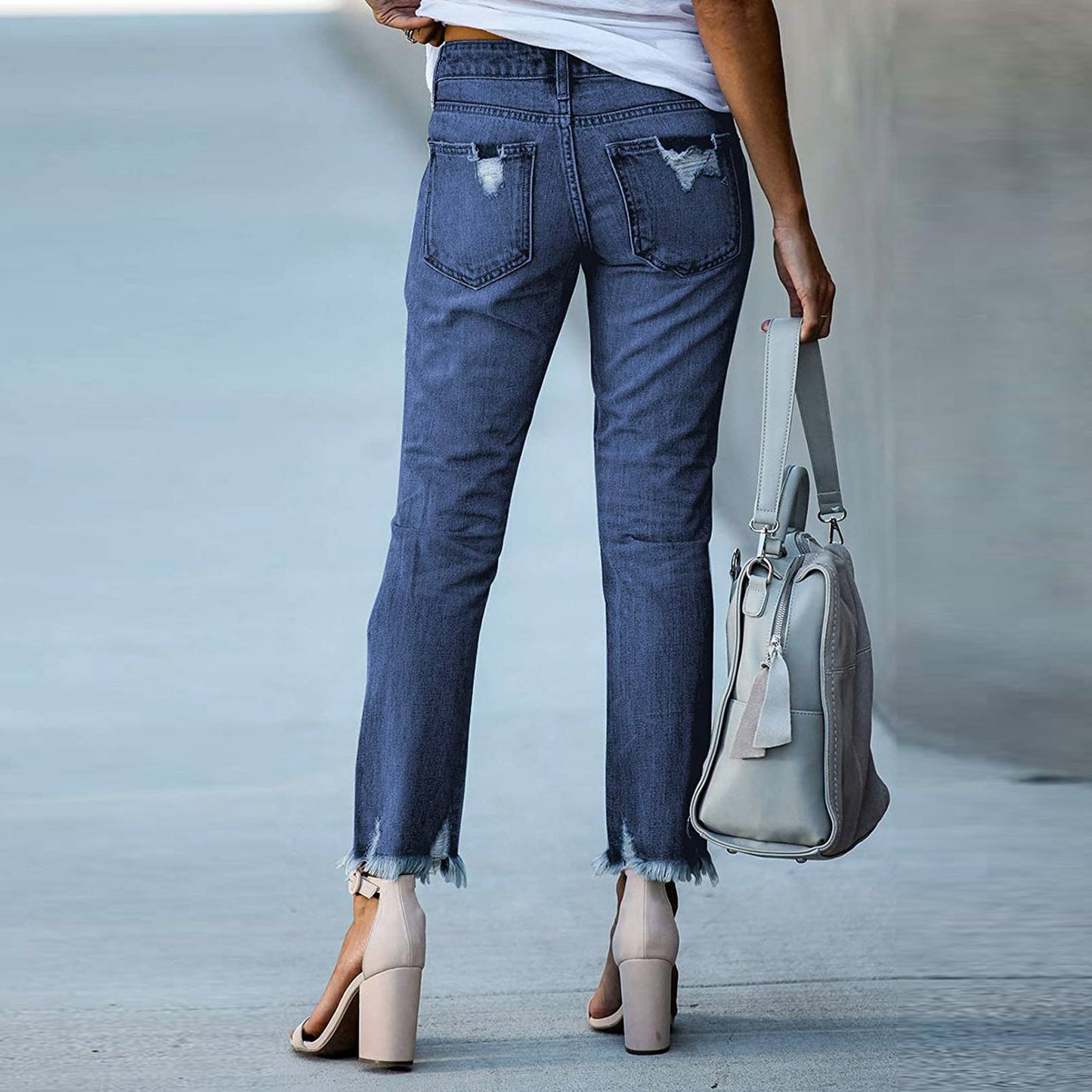 Young women's tight-fitting solid white jeans with ripped jeans